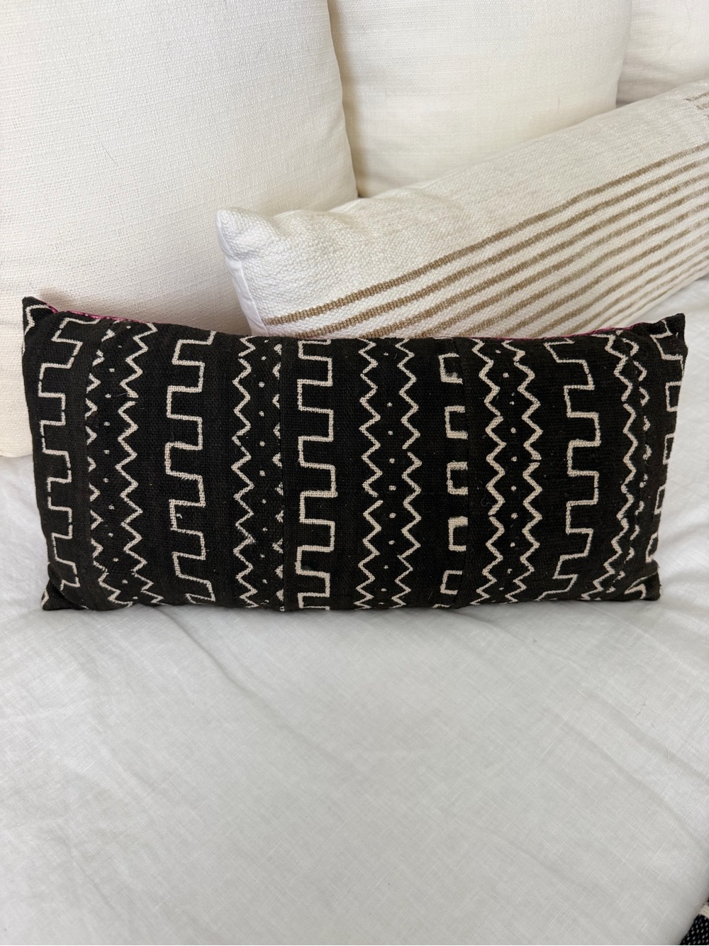 10”x20” Black and Cream mud-cloth Lumbar Pillow with pink fabric on the back